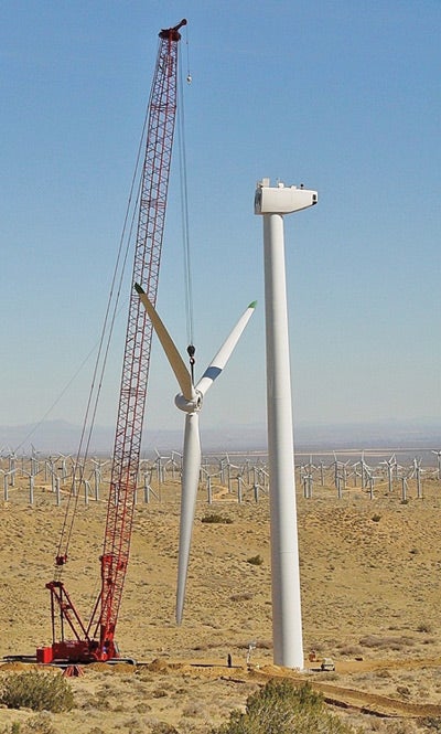2. Heavy lift. A crane lifts an entire blade assembly into place during construction of the 60-MW Oasis Wind Power Project. The project uses 50 Mitsubishi turbines rated at 1 MW each, and its output is sold to San Diego Gas & Electric Co. Courtesy: Mitsubishi Heavy Industries