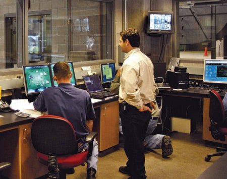 3.	Screening room. Color-coded backgrounds differentiate the controls of the chillers and the combustion turbine. Courtesy: APS Energy Services