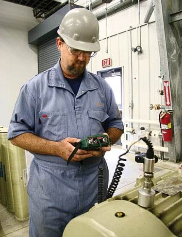 3. Shake, rattle, and roll. Thorp takes a vibration reading from a pump whose repair records he’s seen on-screen. Courtesy: Rockwell Automation