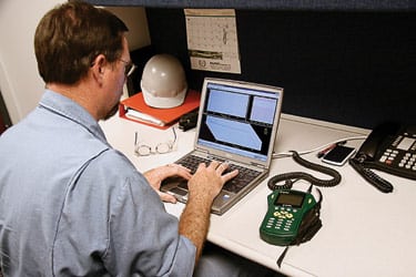 4. Trendspotting. Thorp uses his laptop to check the maintenance history of a troublesome motor-driven pump. Courtesy: Rockwell Automation