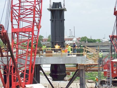 4.	Eight is enough, for now. One of the eight 68-inch x 72-inch SAFV mixed-flow pumps being installed at the London Avenue Canal in New Orleans. Courtesy: Patterson Pump Co.