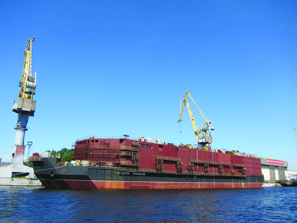 6. Waiting for completion. After years of delay stemming from bankruptcy proceedings affecting the Baltiysky Zavod shipyard, where the flush-decked, non-powered Akademik Lomonosov is being built, the 140-meter by 30-meter floating nuclear power plant is set to be completed in 2016, Russian nuclear corporation Rosatom has announced. Courtesy: Sergei Vavilov/Flickr