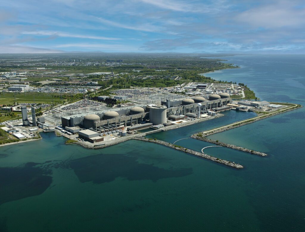 An aerial view of Pickering Nuclear Generating Station from Lake Ontario. Located in Pickering (just east of Toronto), Ontario Power Generation's plant is one of the largest nuclear stations in the world. The plant features six operating CANDU® reactors (CANadian Deuterium Uranium), and accounts for approximately 14% of Ontario’s electricity needs. Courtesy: OPG