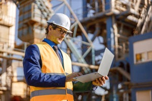 Fig1-engineer-working-on-laptop-at-power-plant_2