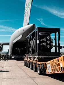 Airmen assigned to the 452nd Logistics Readiness Squadron Aerial Port Flight support loading operations of the Valar Atomics Ward 250 reactor onto a C-17 Globemaster III at March Air Reserve Base, Calif., Feb. 15, 2026. The mission, called "Operation Windlord," marked the first military airlift of a microreactor and transported the Ward 250 to Hill Air Force Base, Utah, en route to the San Rafael Energy Lab test site. Courtesy: Valar Atomics
