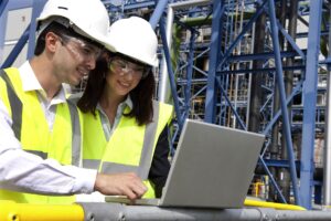 SAP CONCUR Workers looking at a Laptop Image